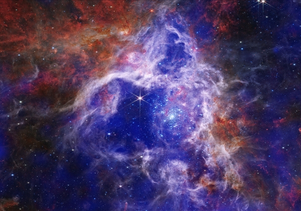 view of stars in space with swirling blue and red colors