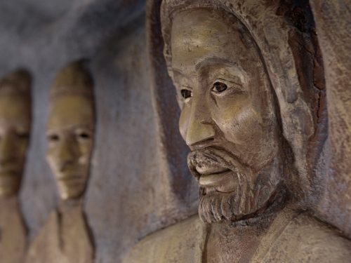 Detail of a stone sculpture depicting Jesus.