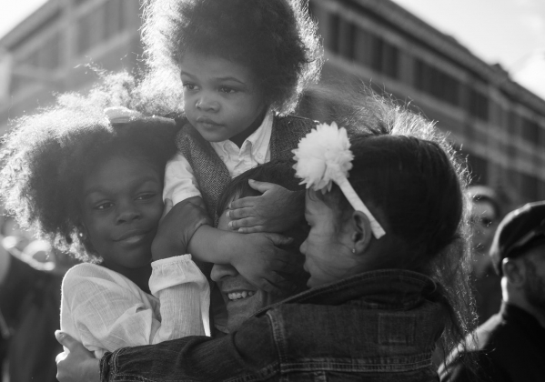 man holding children